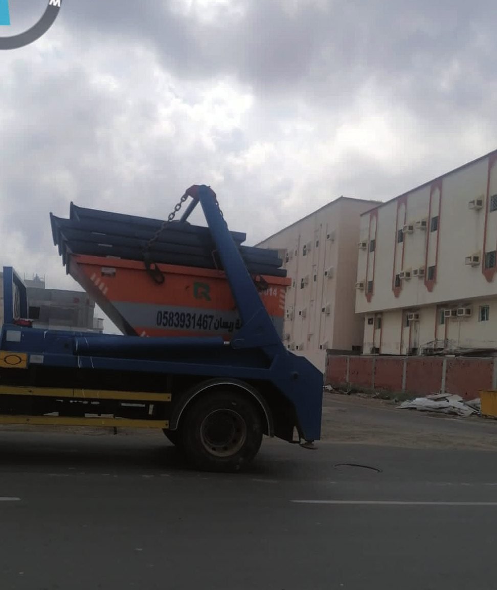 RESAN orange skip container on a city street